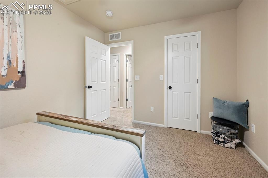 Image 26 of 35: Upstairs, bedroom 3 with step-in closet