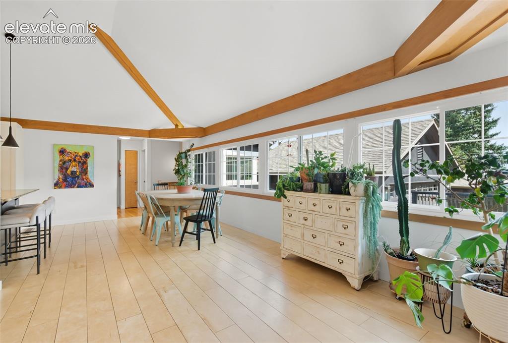 Image 17 of 50: Dining area is open to the kitchen and the living room