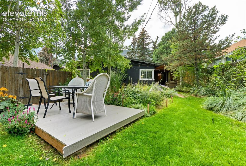 Image 33 of 50: Extra deck in backyard