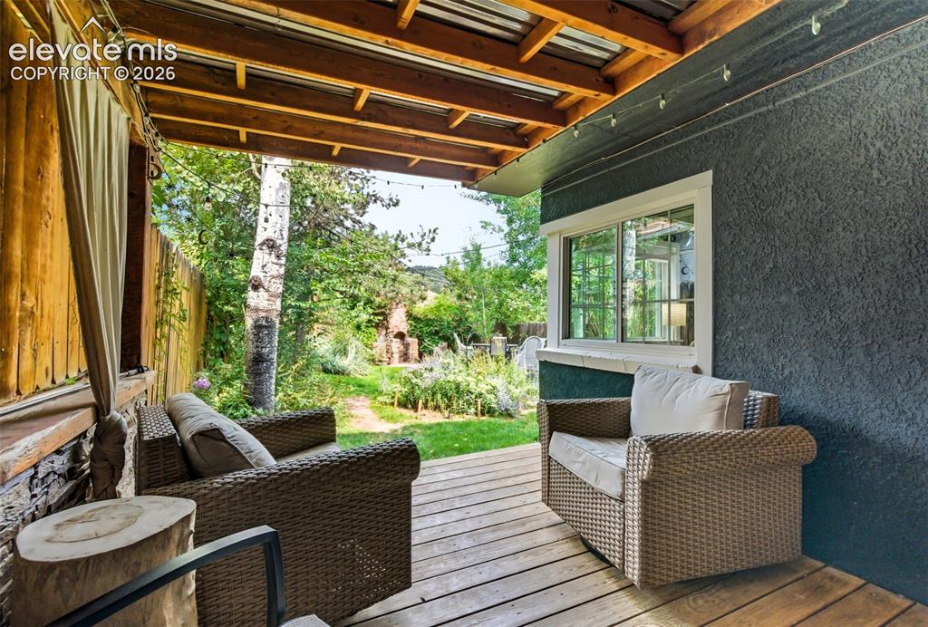 Image 34 of 50: Private deck looking at backyard