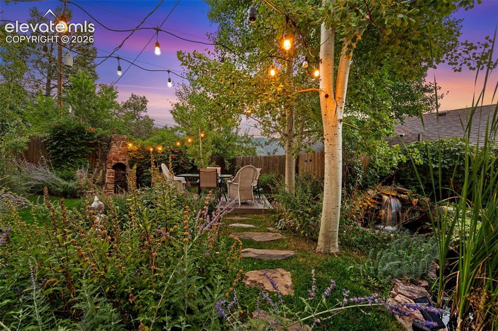 Image 6 of 50: Oasis backyard with aspen and apple trees