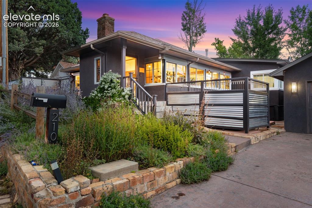 Image 8 of 50: The hot tub is behind this fence