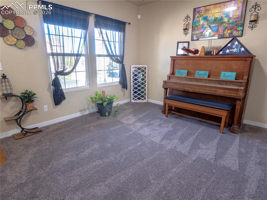 Image 7 of 32: Sitting room featuring carpet floors and baseboards