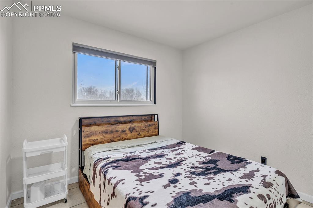 Image 22 of 44: Bedroom with baseboards