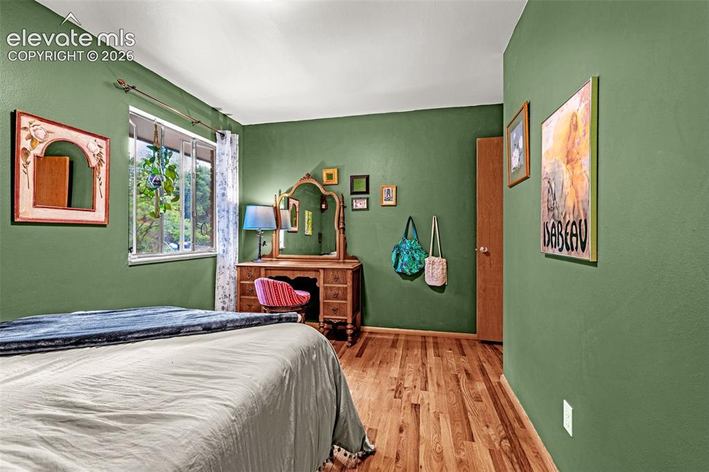 Image 20 of 38: Hardwood flooring featuring a natural wood tone