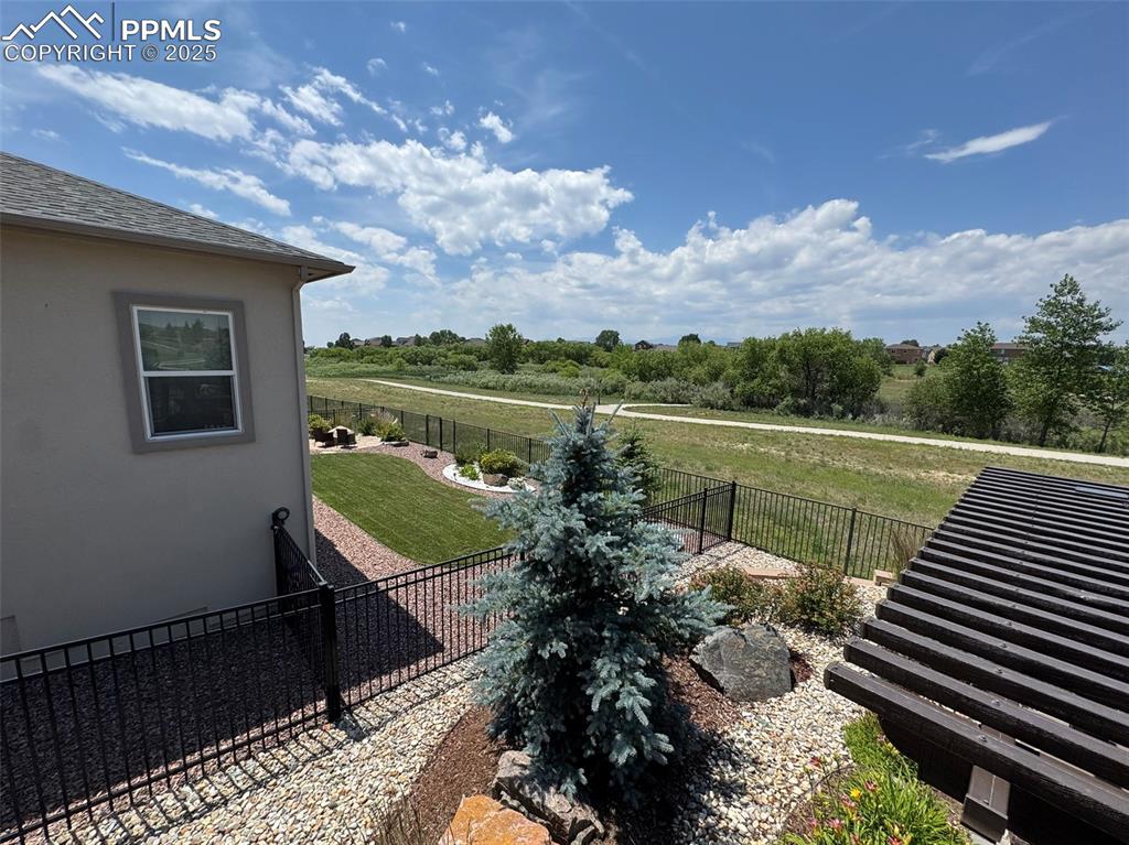 Image 24 of 40: View of fenced backyard