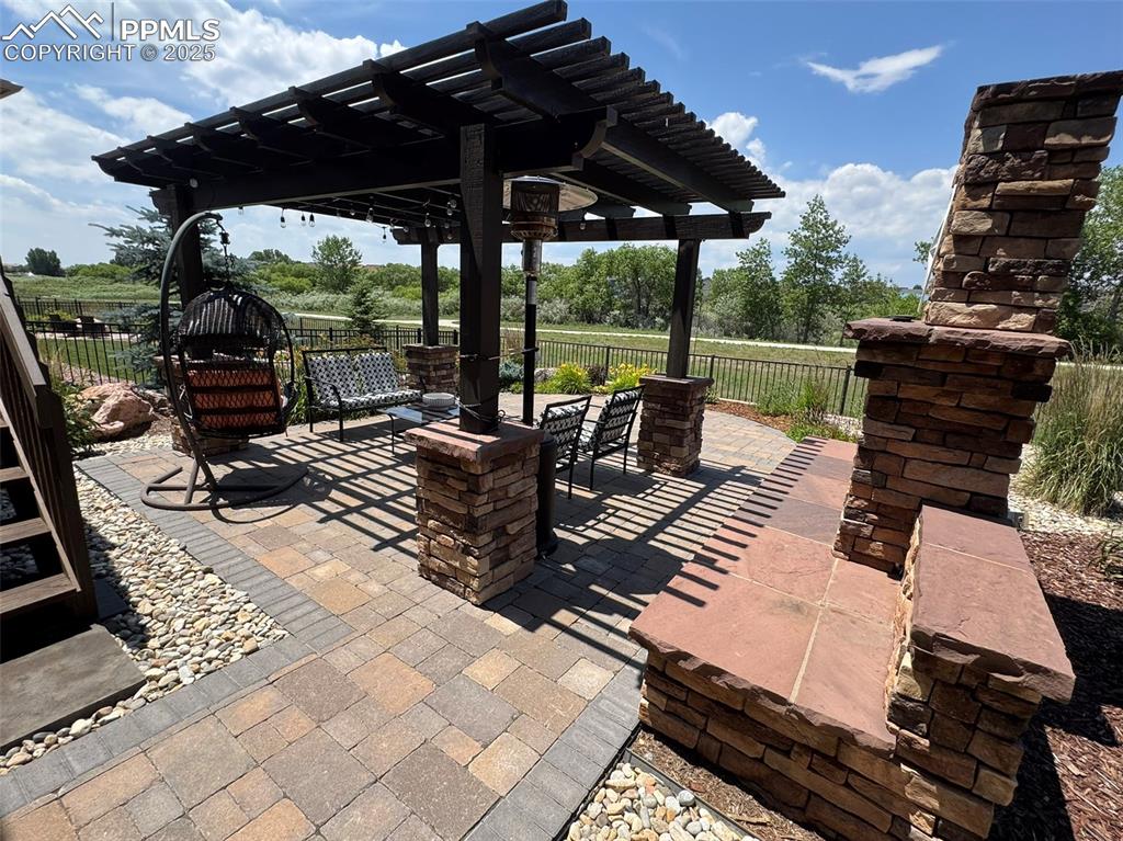 Image 36 of 40: View of patio with a pergola