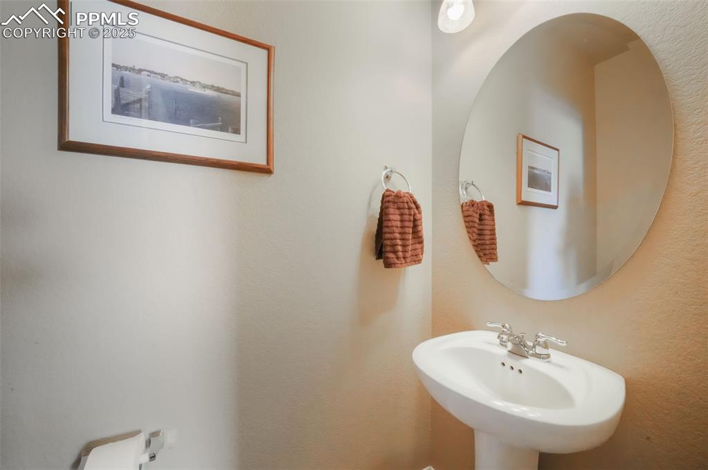 Image 16 of 50: Main level 1/2 bathroom