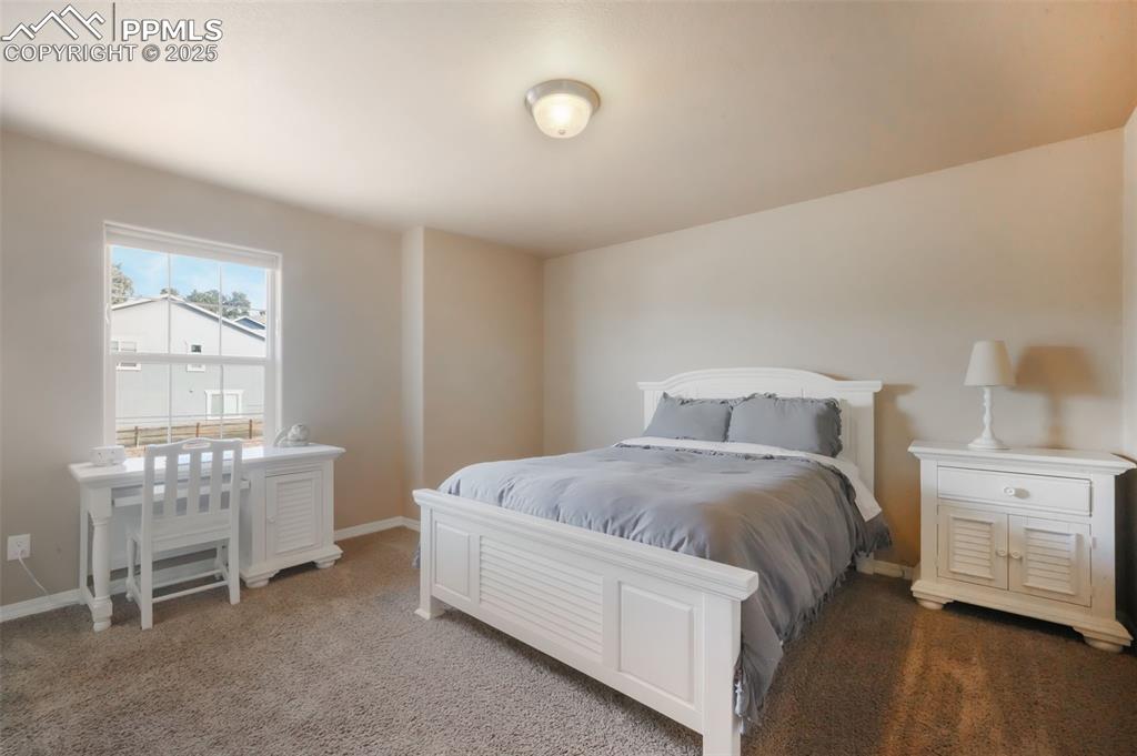 Image 29 of 50: Upstairs second bedroom with walk in closet