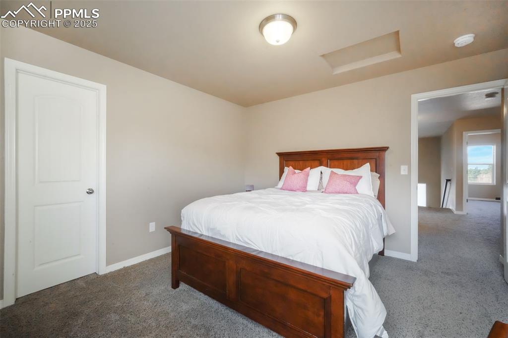 Image 31 of 50: Upstairs third bedroom with walk in closet