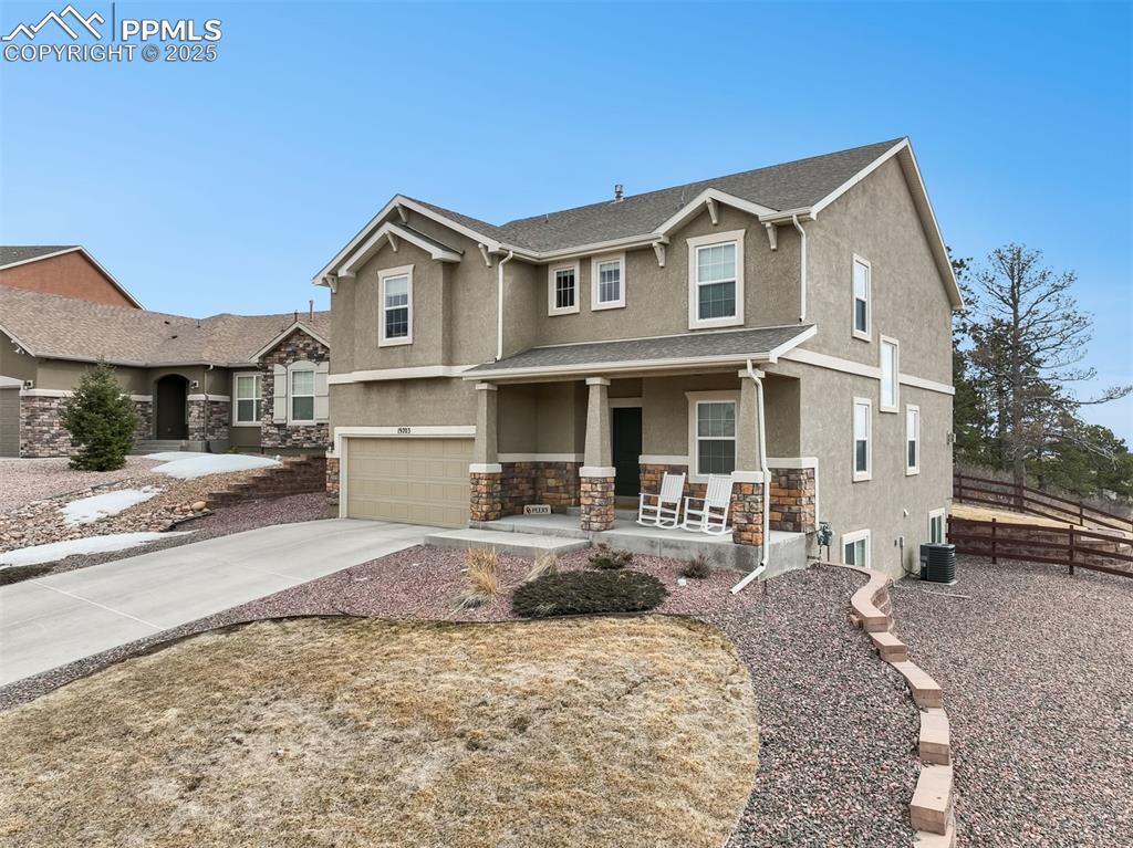 Image 50 of 50: Front of home with mountain views and long driveway 