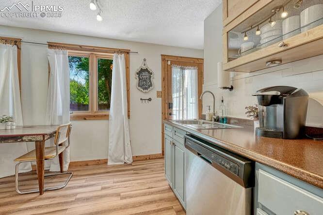 Image 35 of 48: STR portion: Kitchen with track lighting, stainless steel dishwasher, healt