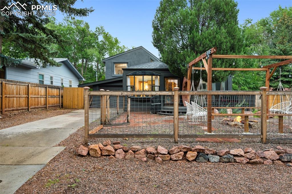 Image 4 of 48: Front of property featuring a vegetable garden