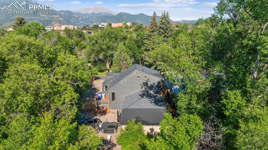 Image 6 of 48: View of subject property with a mountain backdrop