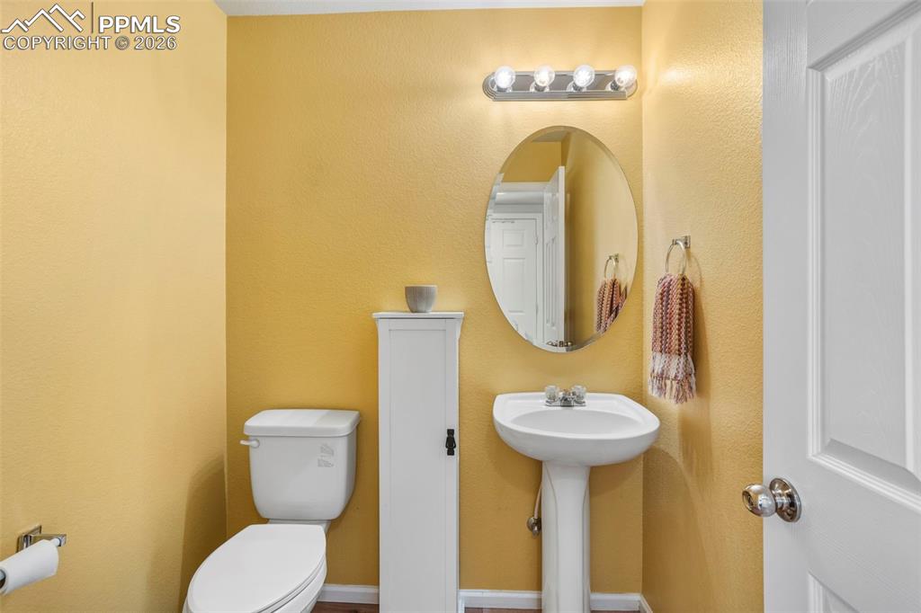 Image 14 of 32: Main floor half bath