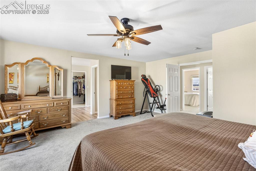 Image 19 of 32: Spacious Primary Bedroom with en suite bathroom