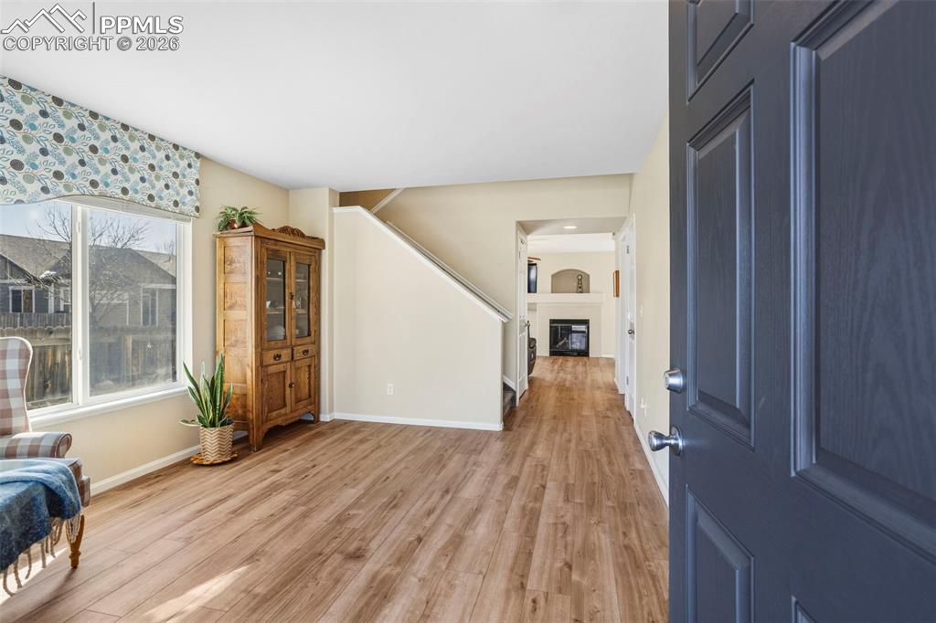 Image 5 of 32: Entry featuring hardwood floors