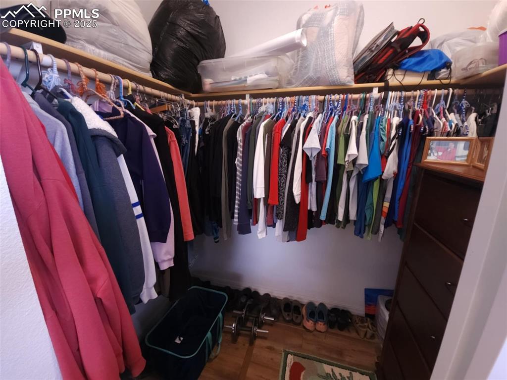 Image 16 of 47: Spacious closet featuring wood finished floors