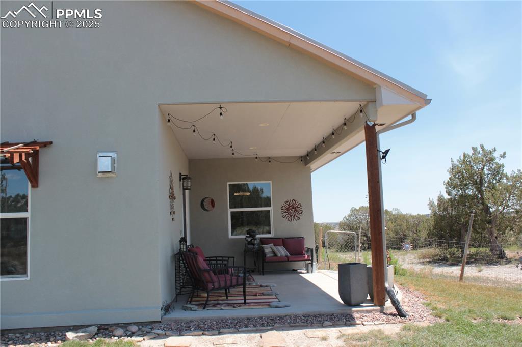 Image 30 of 47: View of patio with an outdoor living space