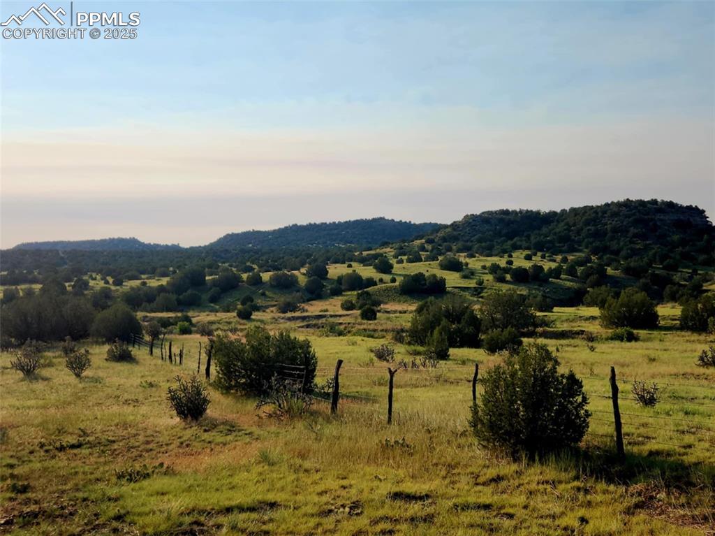 Image 37 of 47: View of mountain background featuring rural landscape