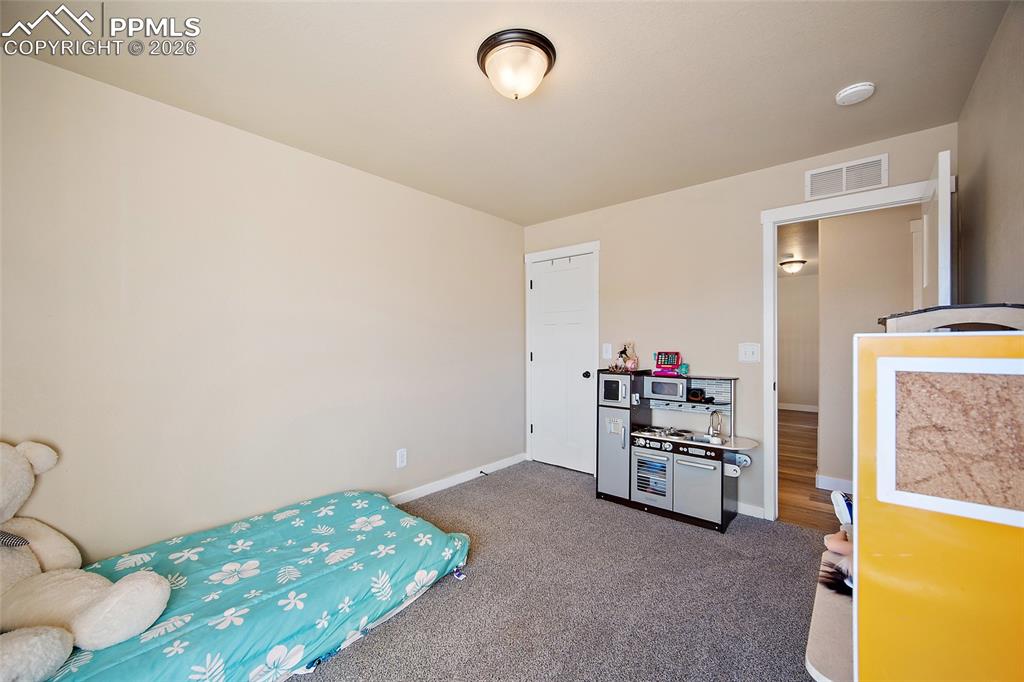 Image 30 of 39: Bedroom