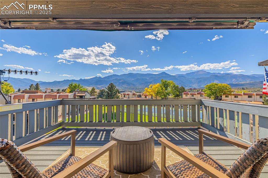 Image 3 of 28: Back deck with the most amazing views of pikes peak and garden of the gods