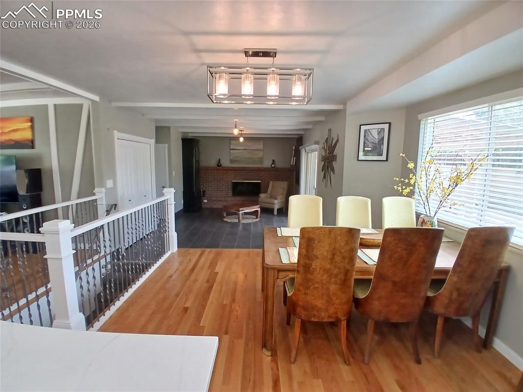 Image 18 of 49: Dining space with hardwood floors.