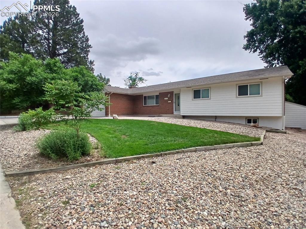 Image 2 of 49: View of front of house with a front lawn