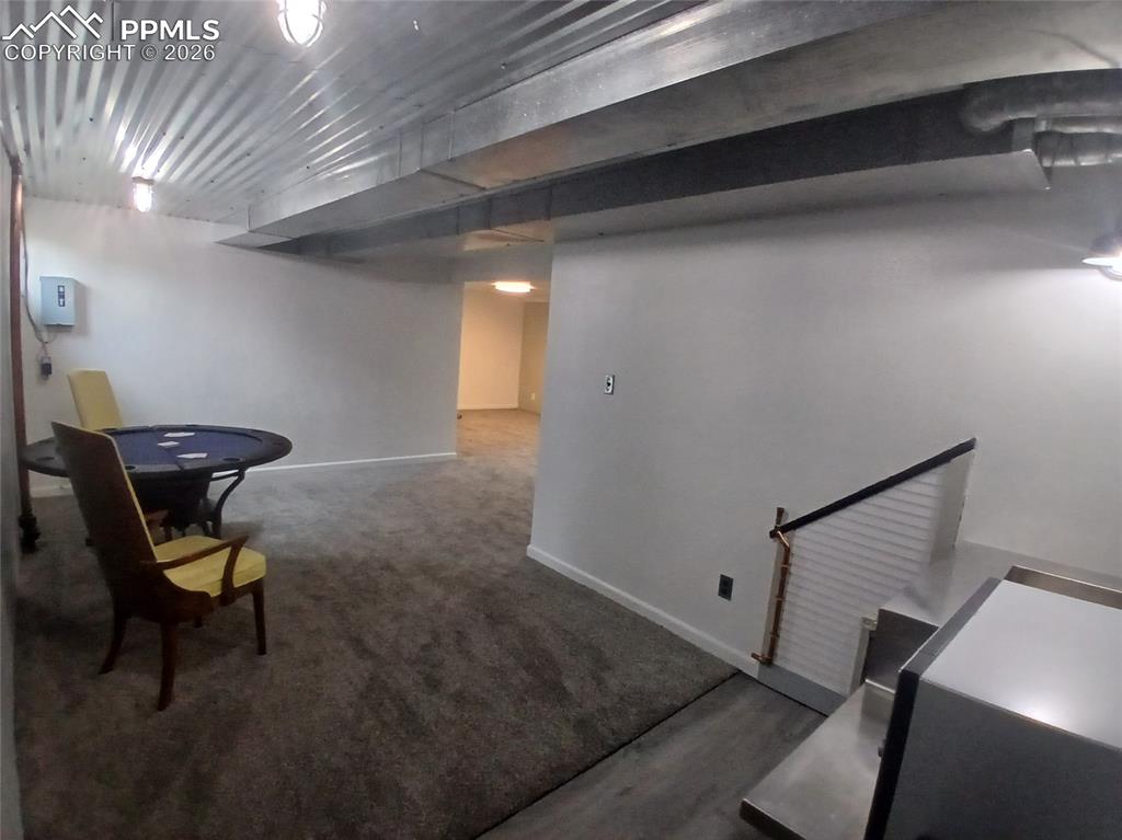 Image 37 of 49: Basement with carpet flooring