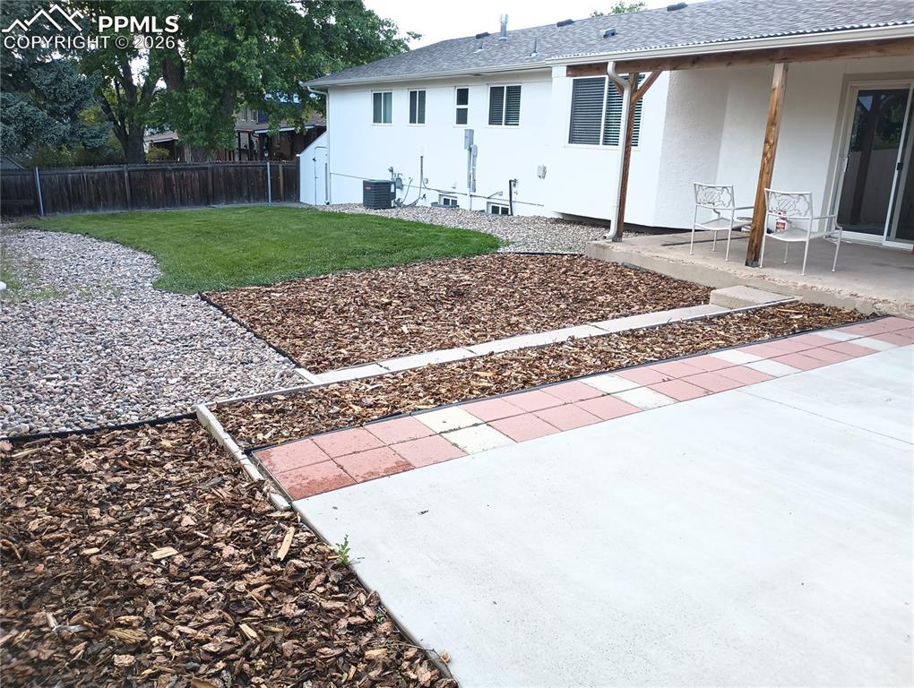 Image 49 of 49: View of yard with a patio area and central AC unit