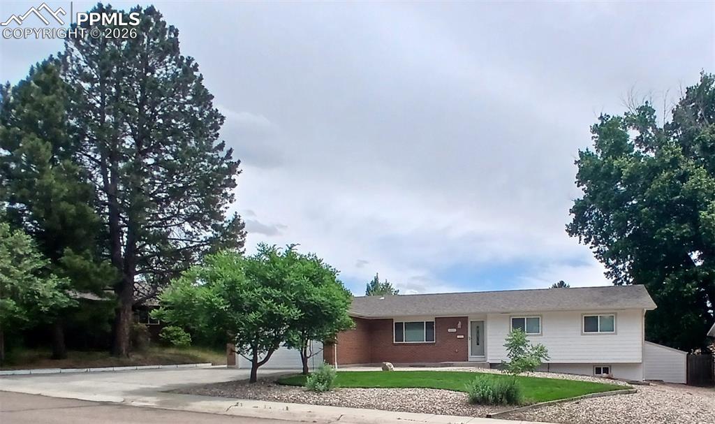 Image 5 of 49: Ranch-style house with a 2-car garage