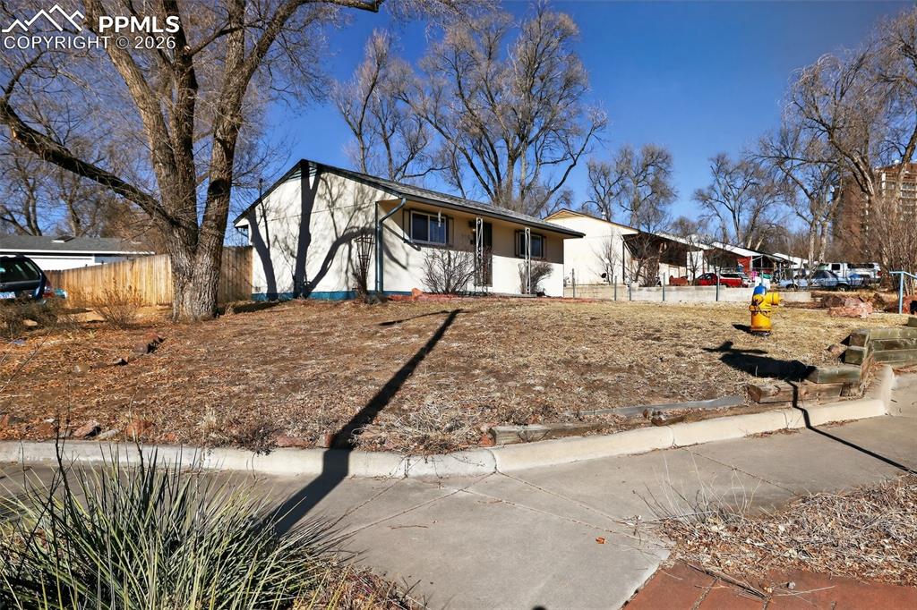 Image 6 of 15: Ranch-style house with stucco siding
