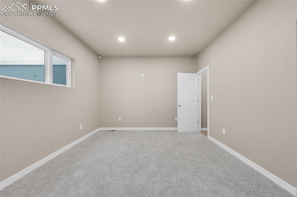Image 3 of 15: Carpeted empty room with baseboards and recessed lighting
