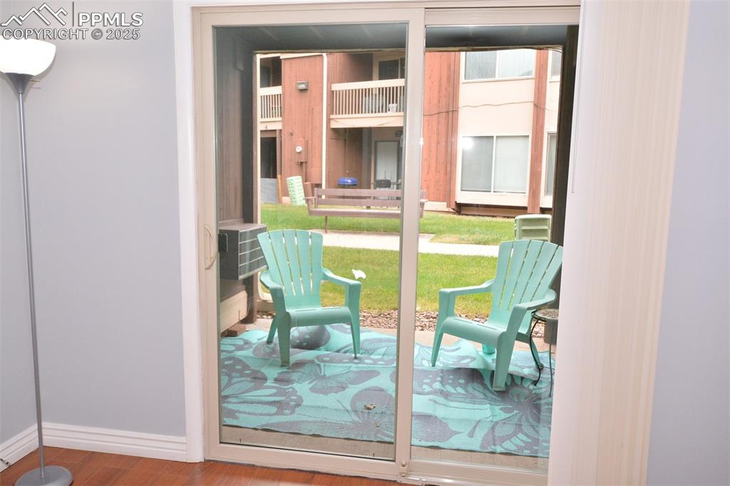 Image 15 of 24: Walk-out from bedroom to covered back patio