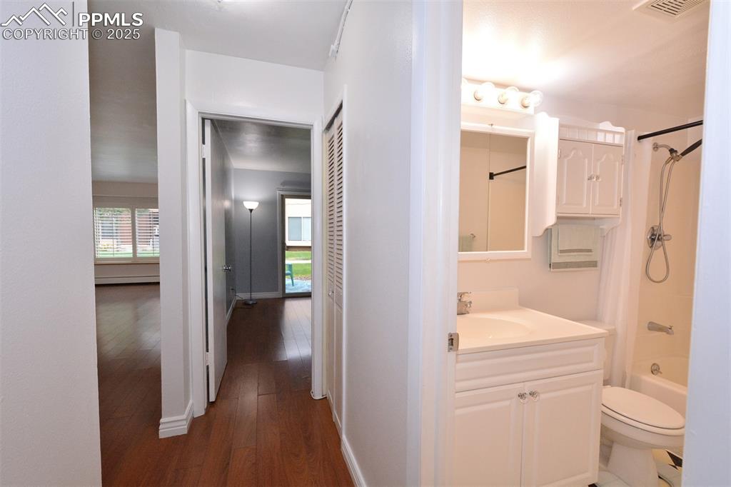 Image 16 of 24: hallway to bedroom/bathroom