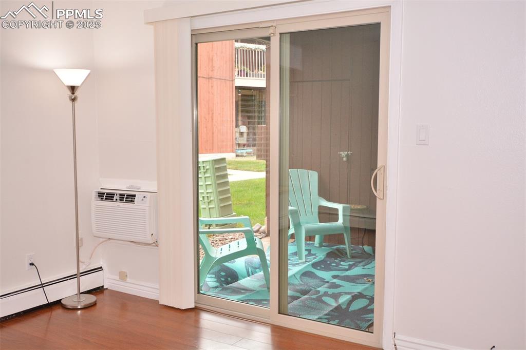 Image 8 of 24: Walk out from the living room to a covered patio