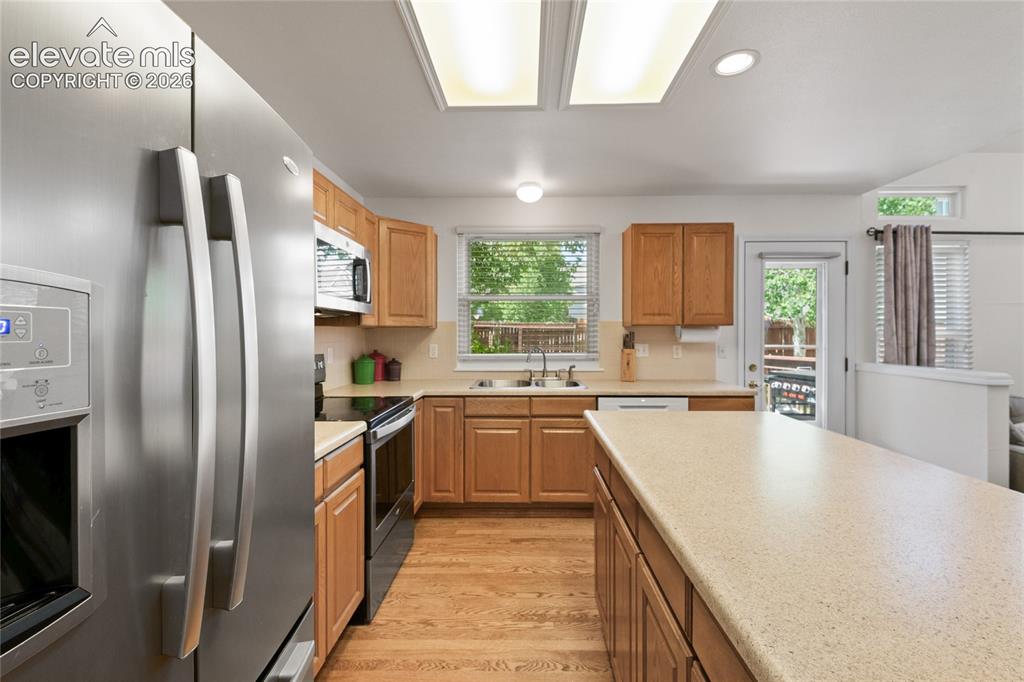 Image 12 of 50: Very workable kitchen with lots of cabinets