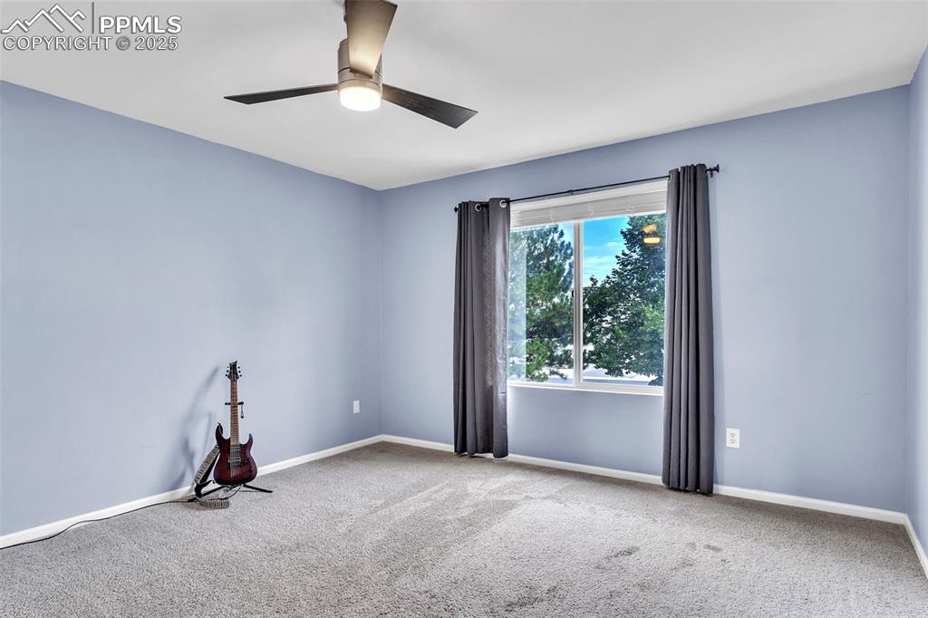 Image 12 of 26: Unfurnished room with carpet floors and baseboards