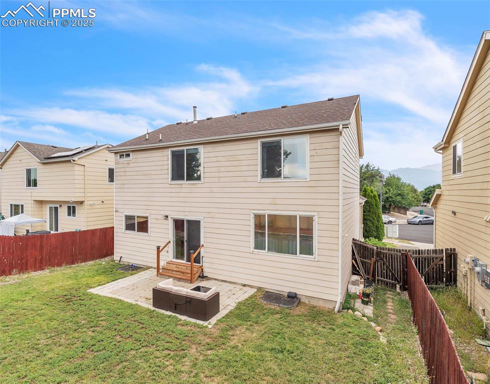 Image 26 of 26: Back of house with a patio area, a fenced backyard, and entry steps
