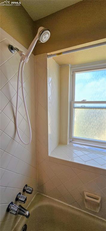Image 36 of 48: Bathroom with washtub / shower combination