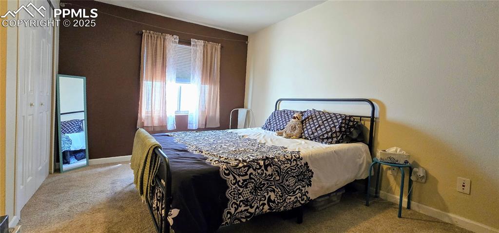 Image 38 of 48: Carpeted bedroom featuring baseboards