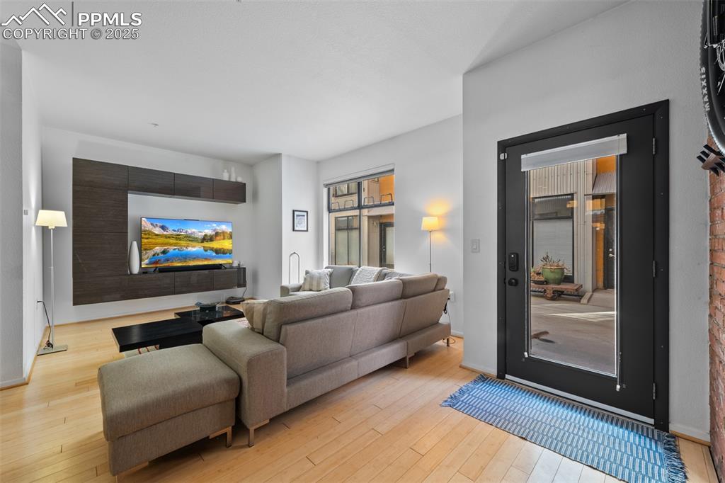 Image 9 of 26: Living room featuring hardwood / wood-style flooring