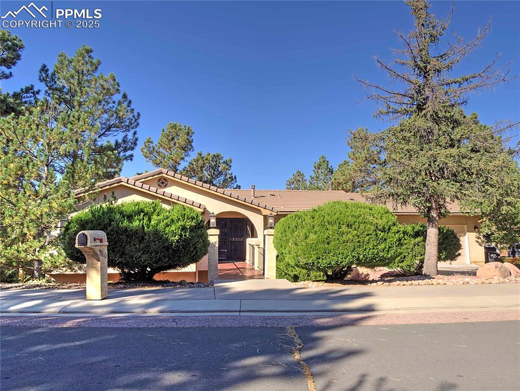 Image 2 of 41: Mediterranean / spanish-style home featuring stucco siding and a tile roof