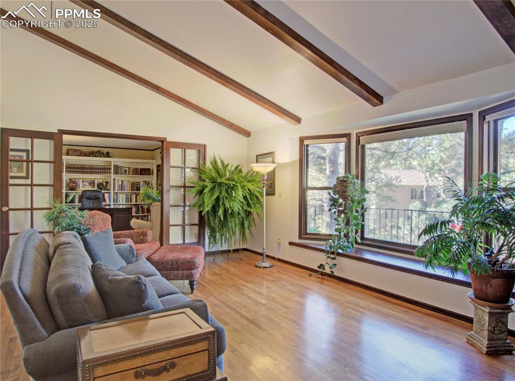 Image 8 of 41: Living room featuring light wood-style flooring and baseboards