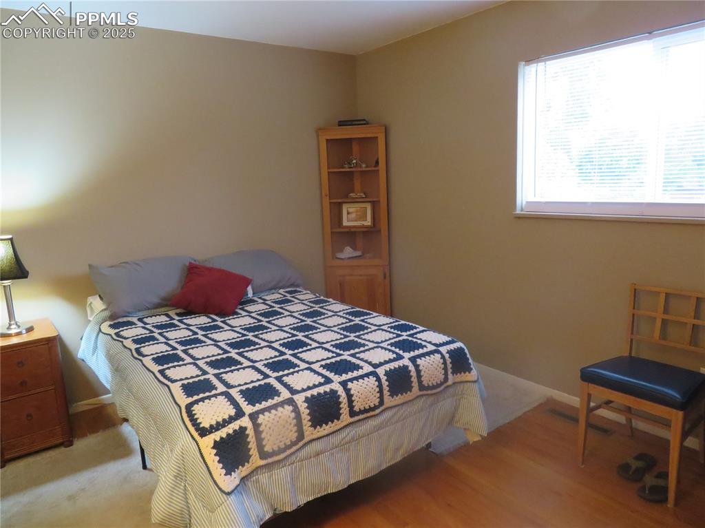 Image 31 of 39: Upper Secondary Bedroom wood floor