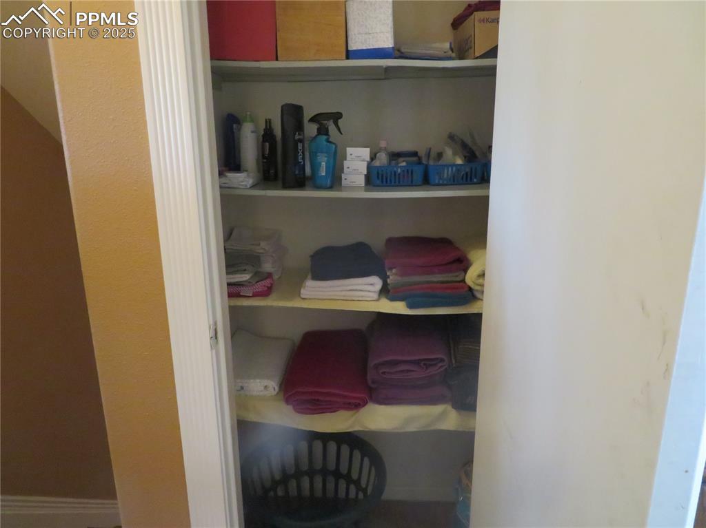 Image 34 of 39: Linen closet