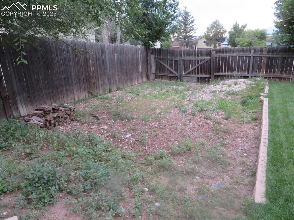 Image 9 of 39: RV Parking with gate.