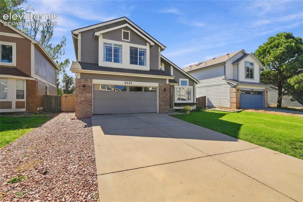Image 1 of 45: Two-story residence featuring a gabled roofline and a two-car garage
