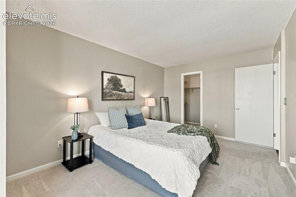 Image 28 of 45: Carpeted flooring, neutral wall tones, and overhead lighting