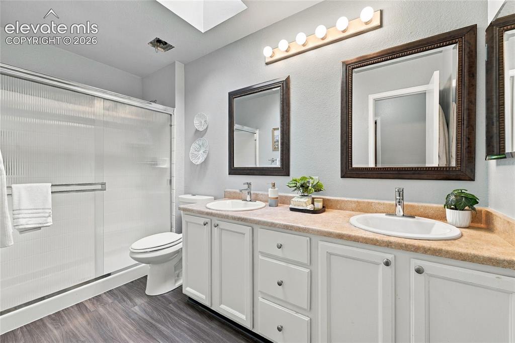 Image 31 of 45: Secondary bathroom featuring a dual-sink